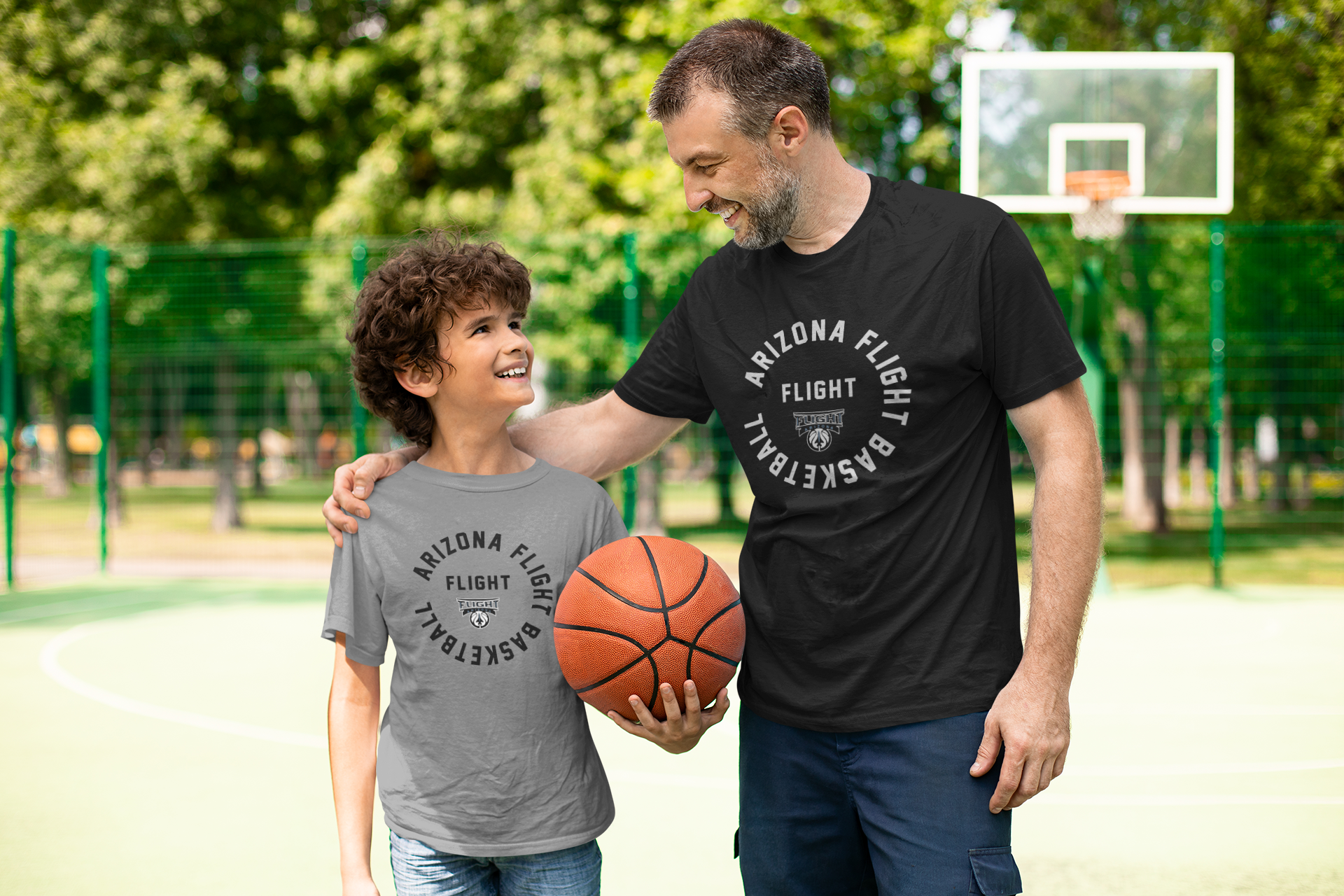 Dad and son in matching team tees
